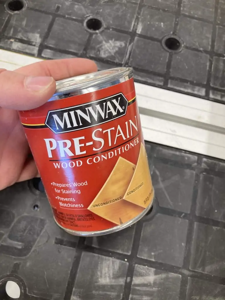 A can of pre-stain wood conditioner.